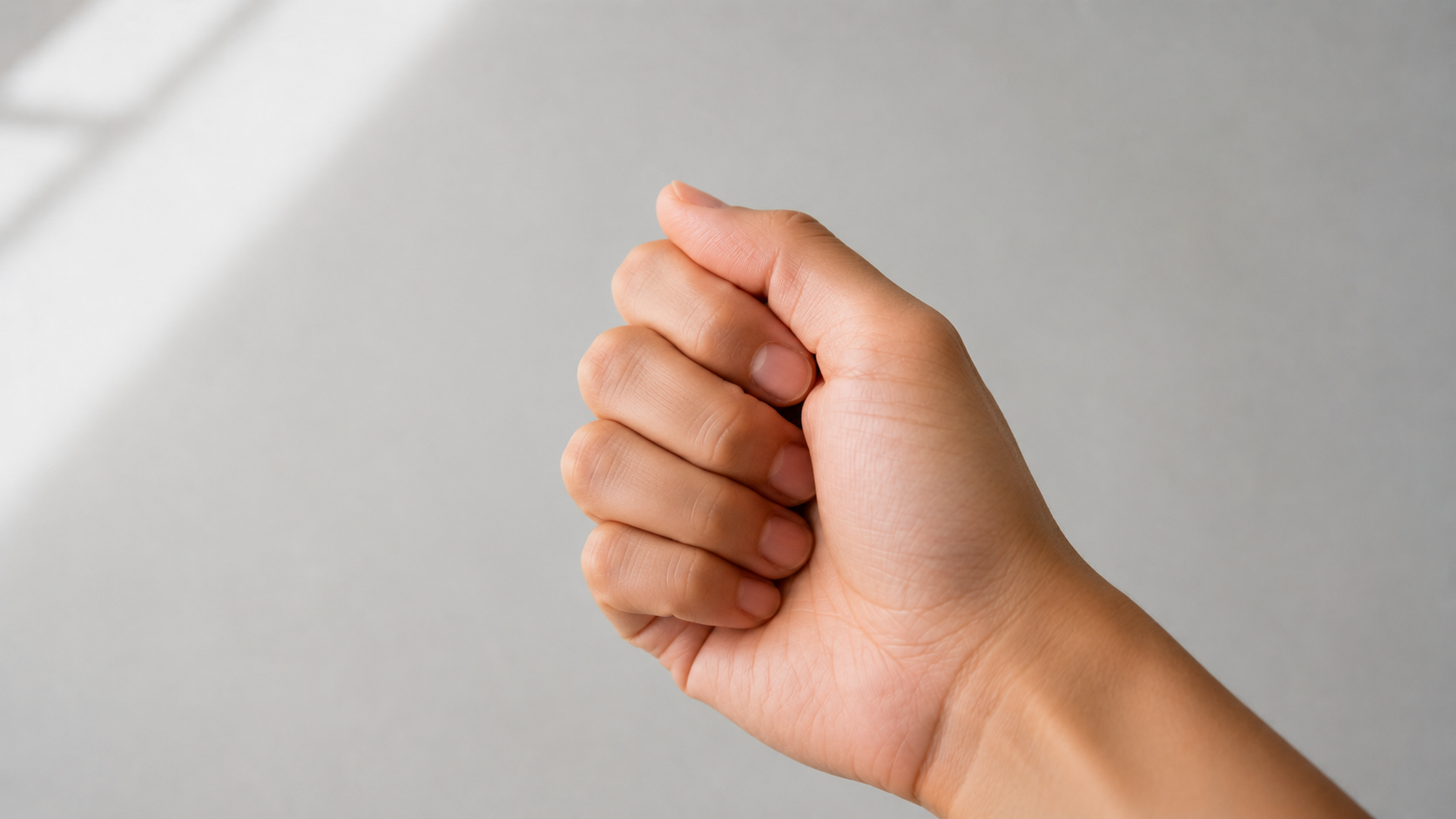 A loose, relaxed fist — not clenched