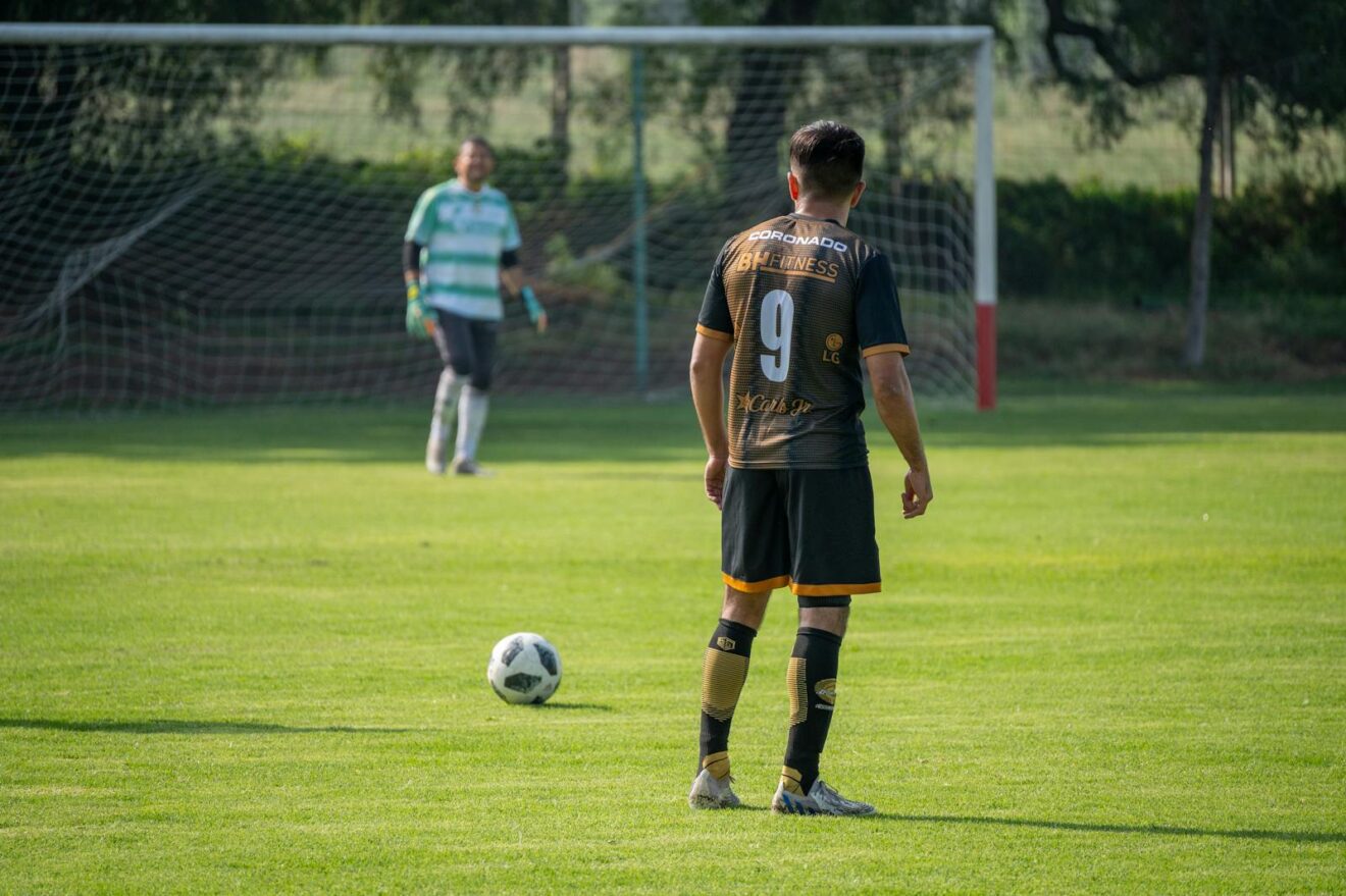 Why First Kickers Tend to Win Soccer Penalty Shootouts